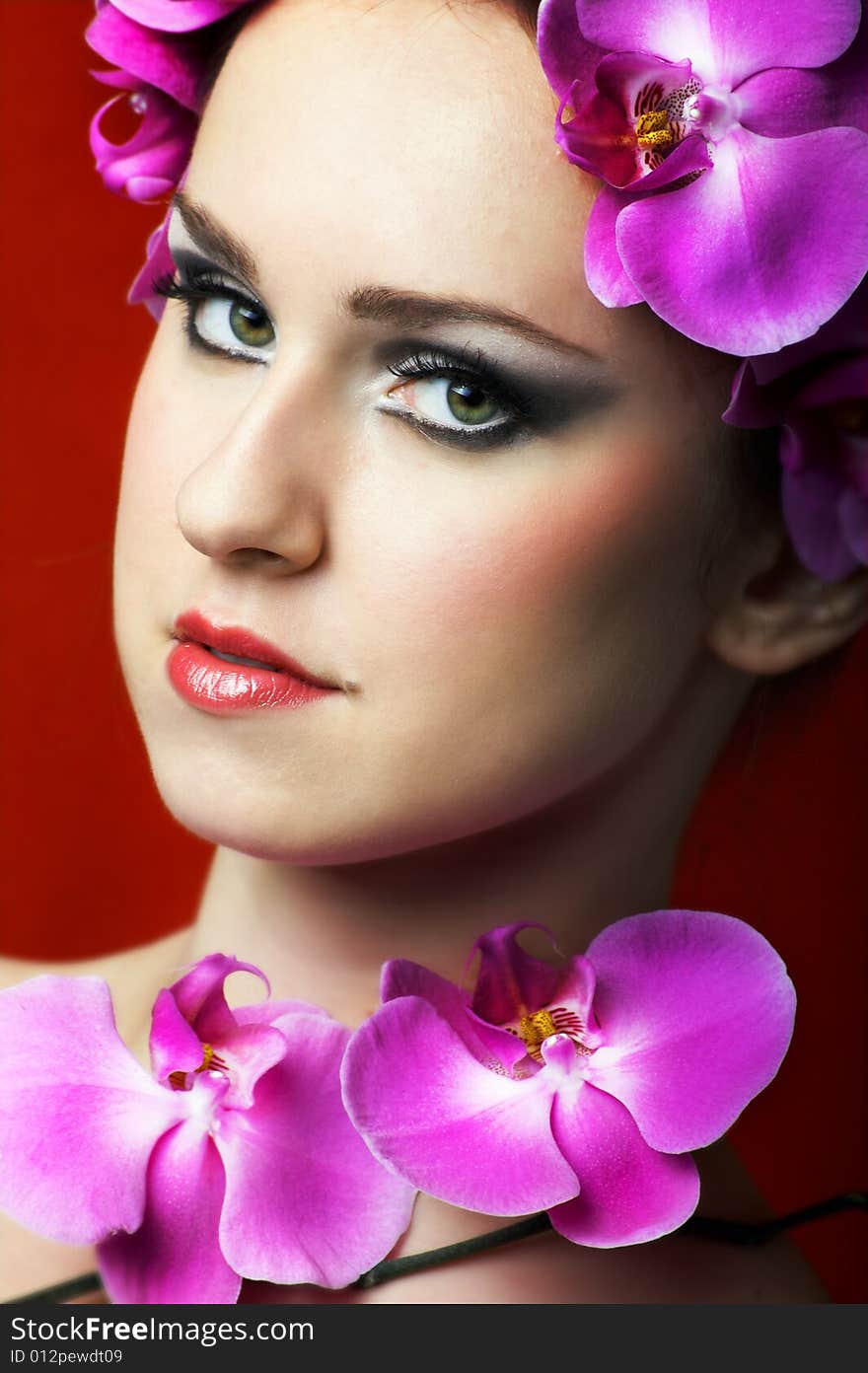 Beauty portrait of a woman with flowers