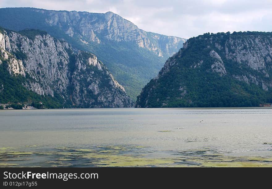 A picture of mountain river with dark clouds