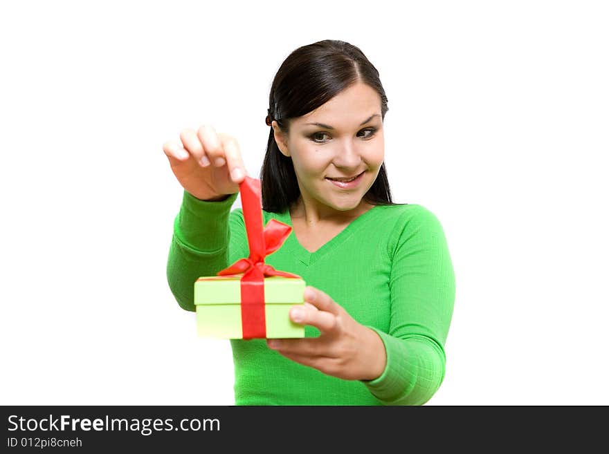 Attractive brunette woman holding gift on white background. Attractive brunette woman holding gift on white background