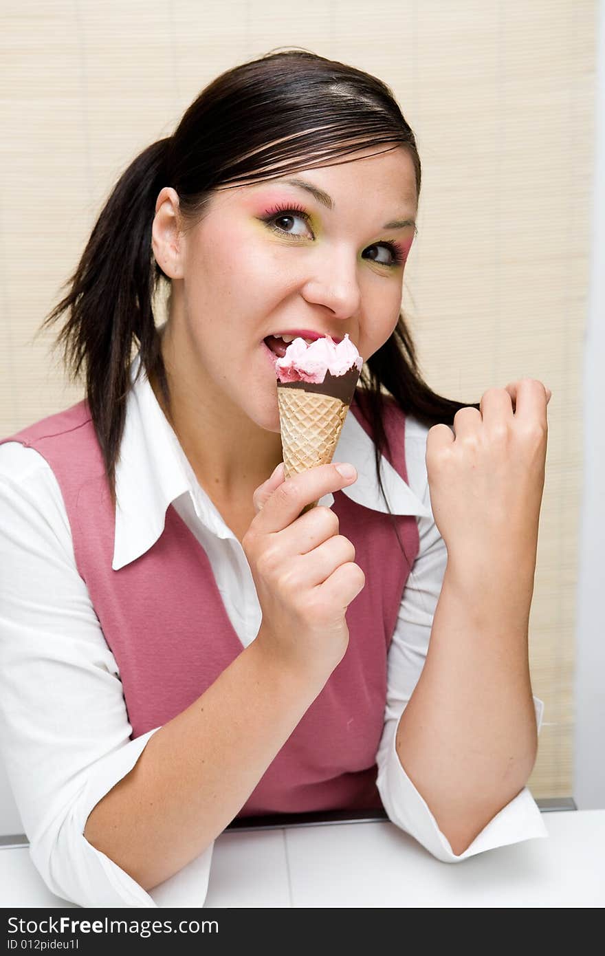 Attractive brunette woman with ice cream. Attractive brunette woman with ice cream