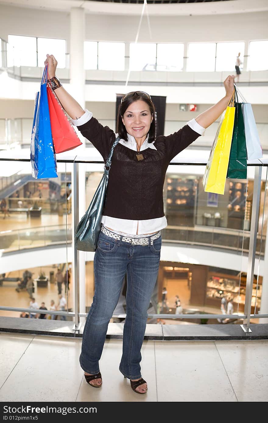 Attractive brunette woman with shopping bags