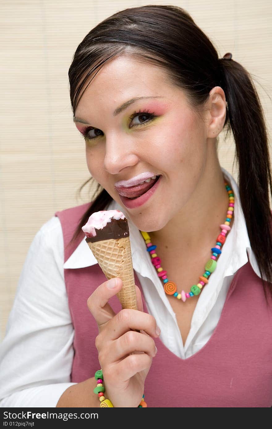 Attractive brunette woman with ice cream. Attractive brunette woman with ice cream