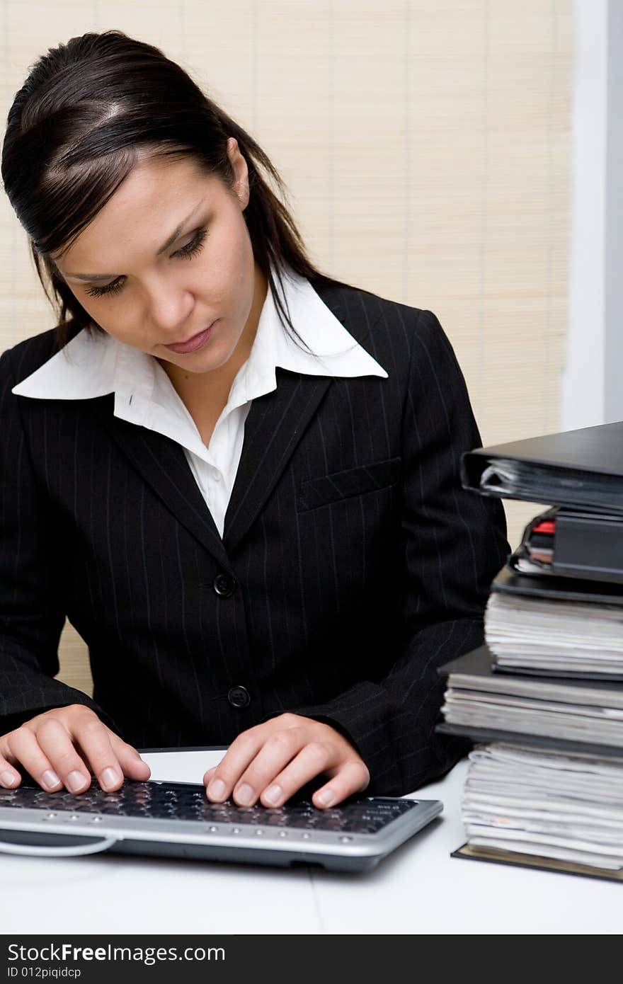 Attractive brunette woman at work. Attractive brunette woman at work