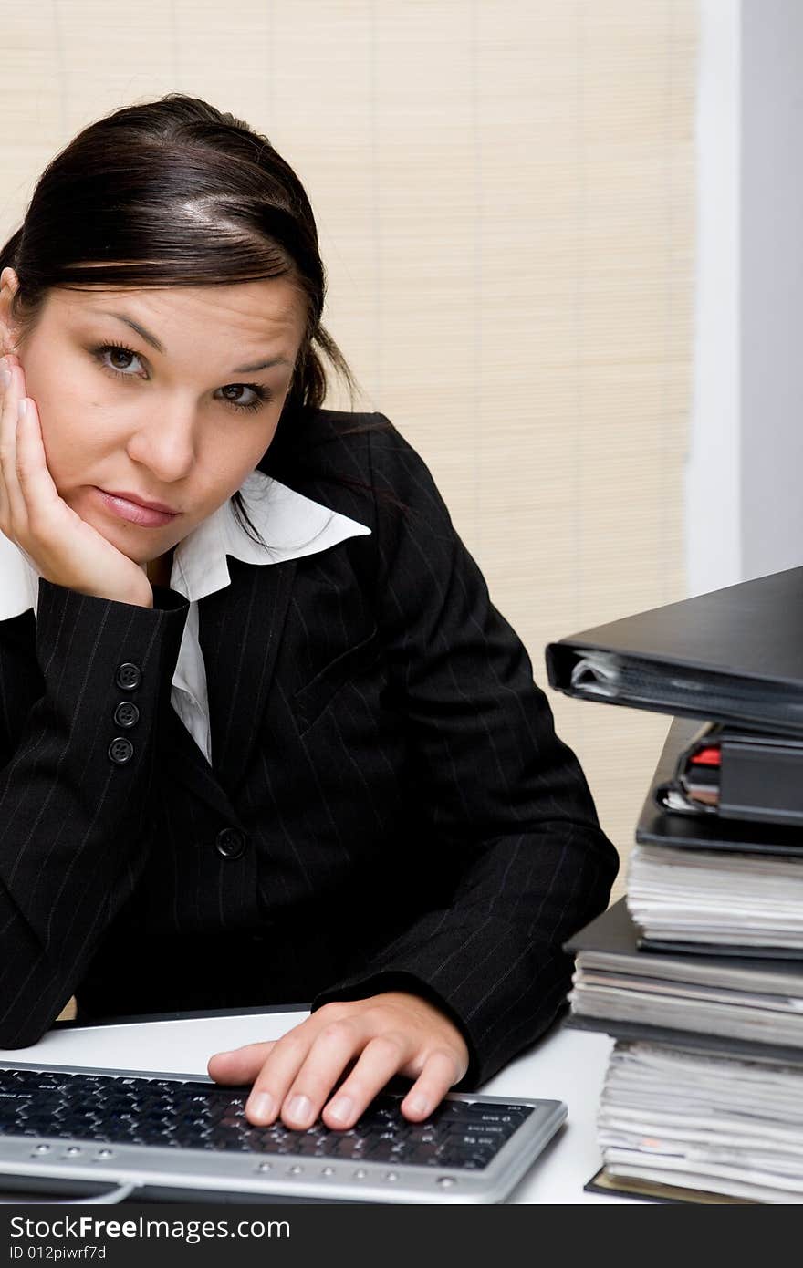 Attractive brunette woman at work. Attractive brunette woman at work