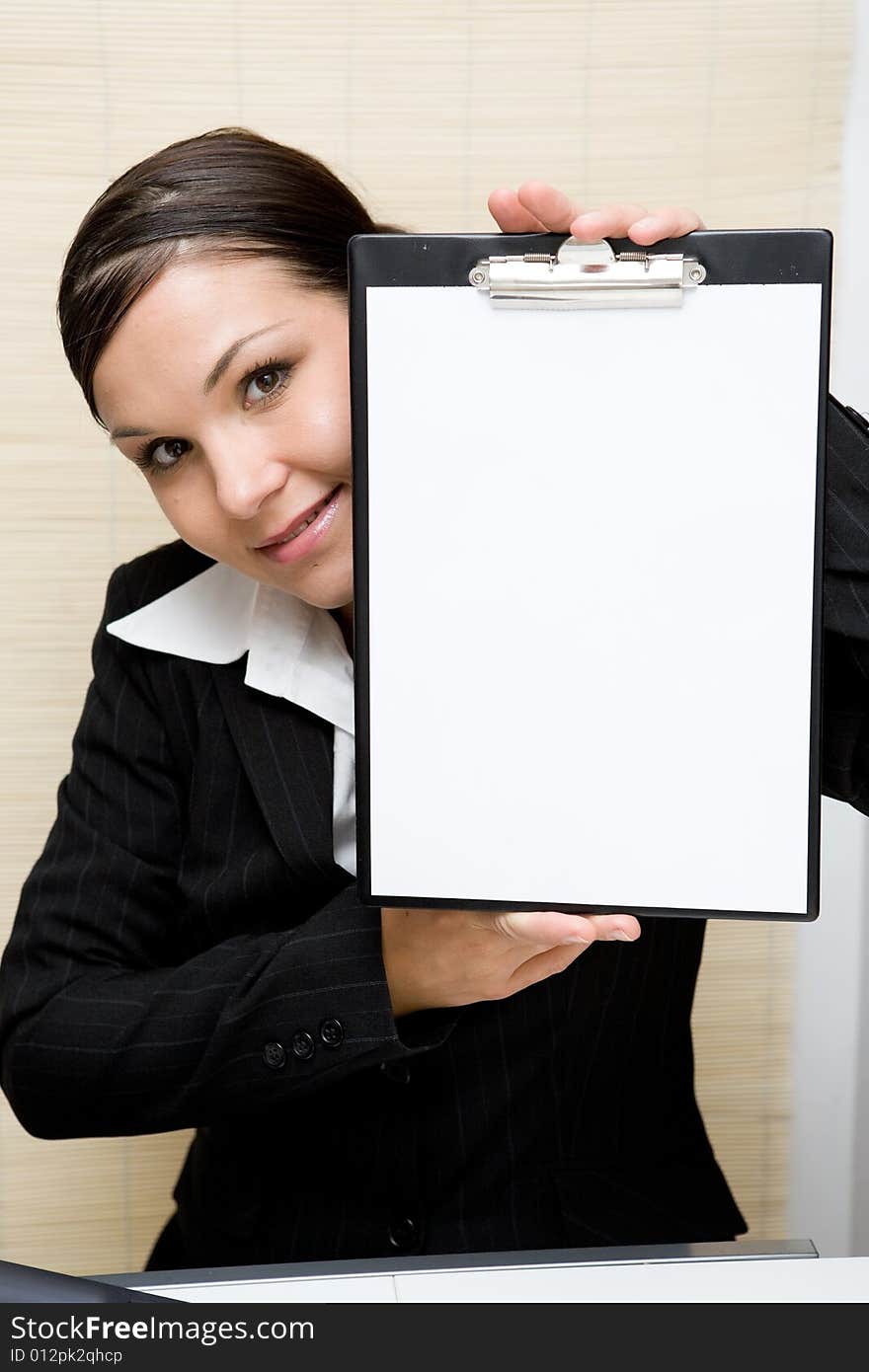 Attractive brunette woman at work. Attractive brunette woman at work