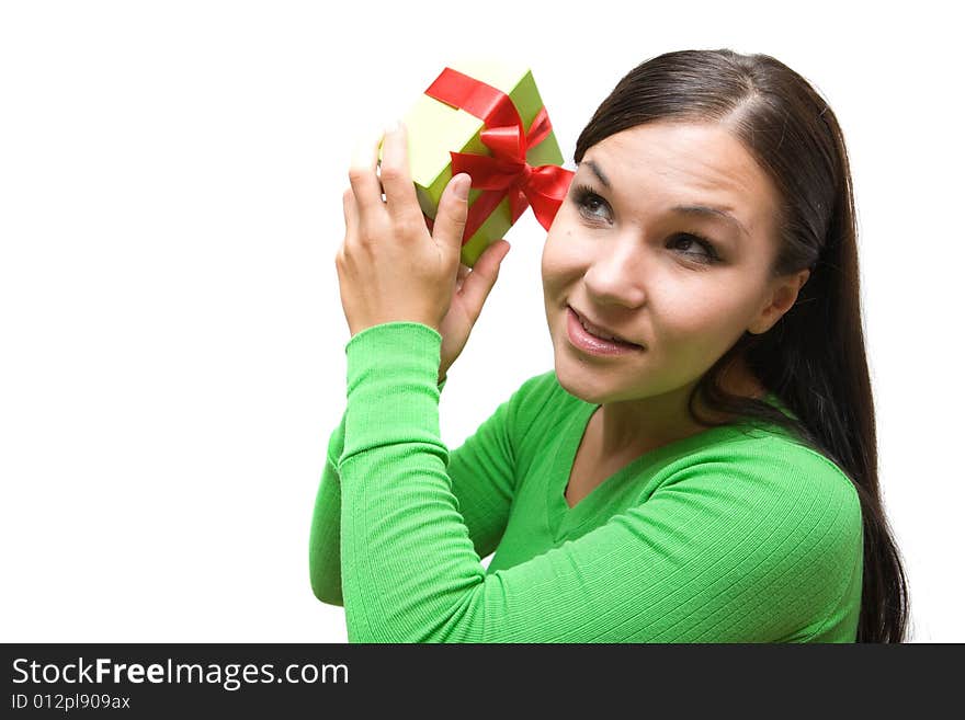 Attractive brunette woman holding gift on white background. Attractive brunette woman holding gift on white background