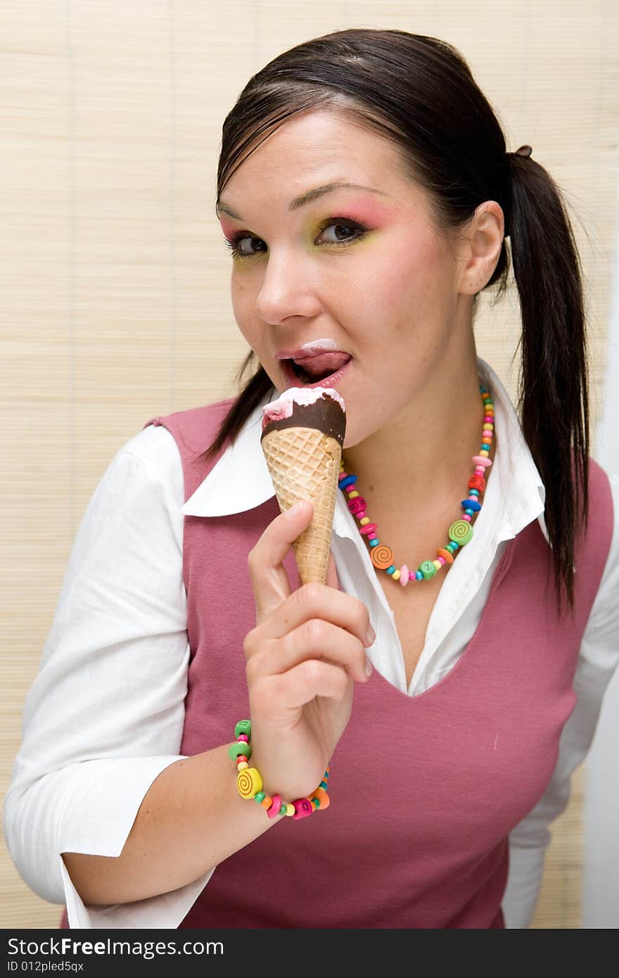 Attractive brunette woman with ice cream. Attractive brunette woman with ice cream