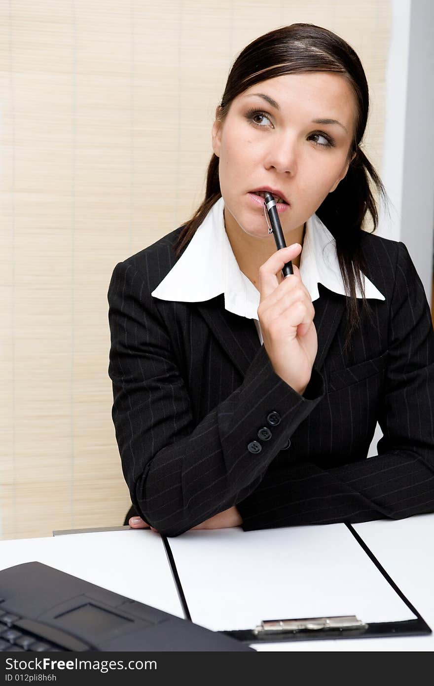 Attractive brunette woman at work. Attractive brunette woman at work