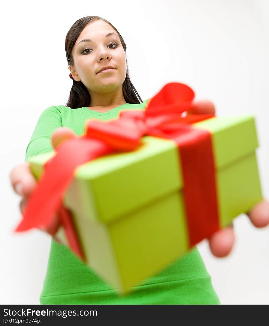 Attractive brunette woman holding gift on white background. Attractive brunette woman holding gift on white background