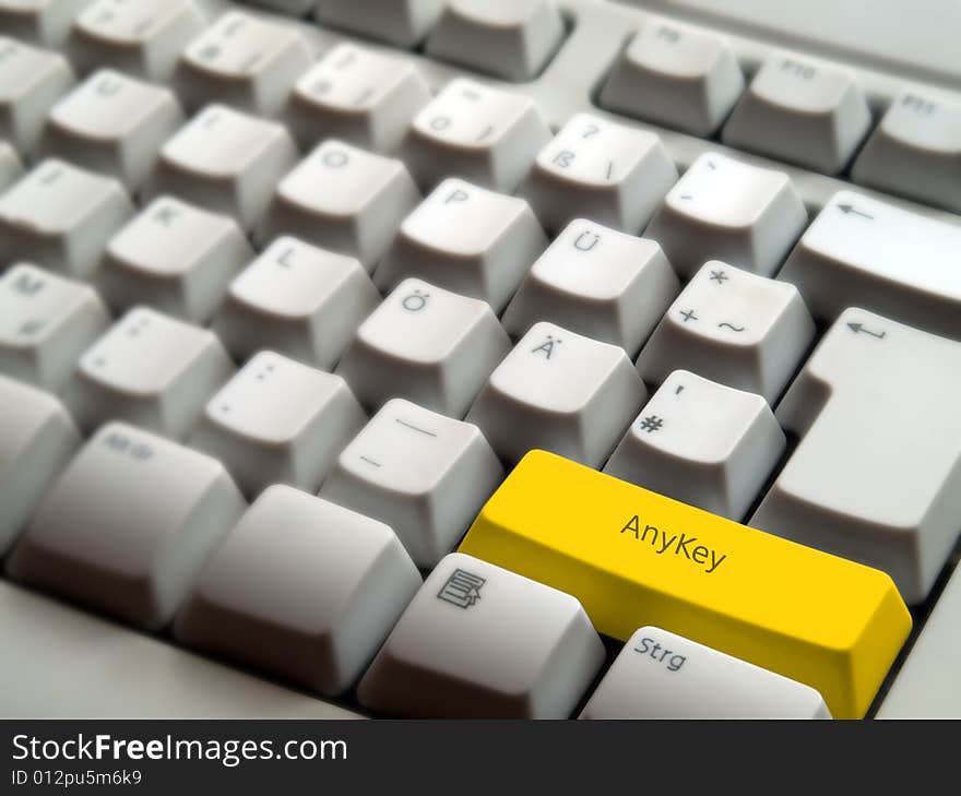 A computer keyboard with an yellow AnyKey