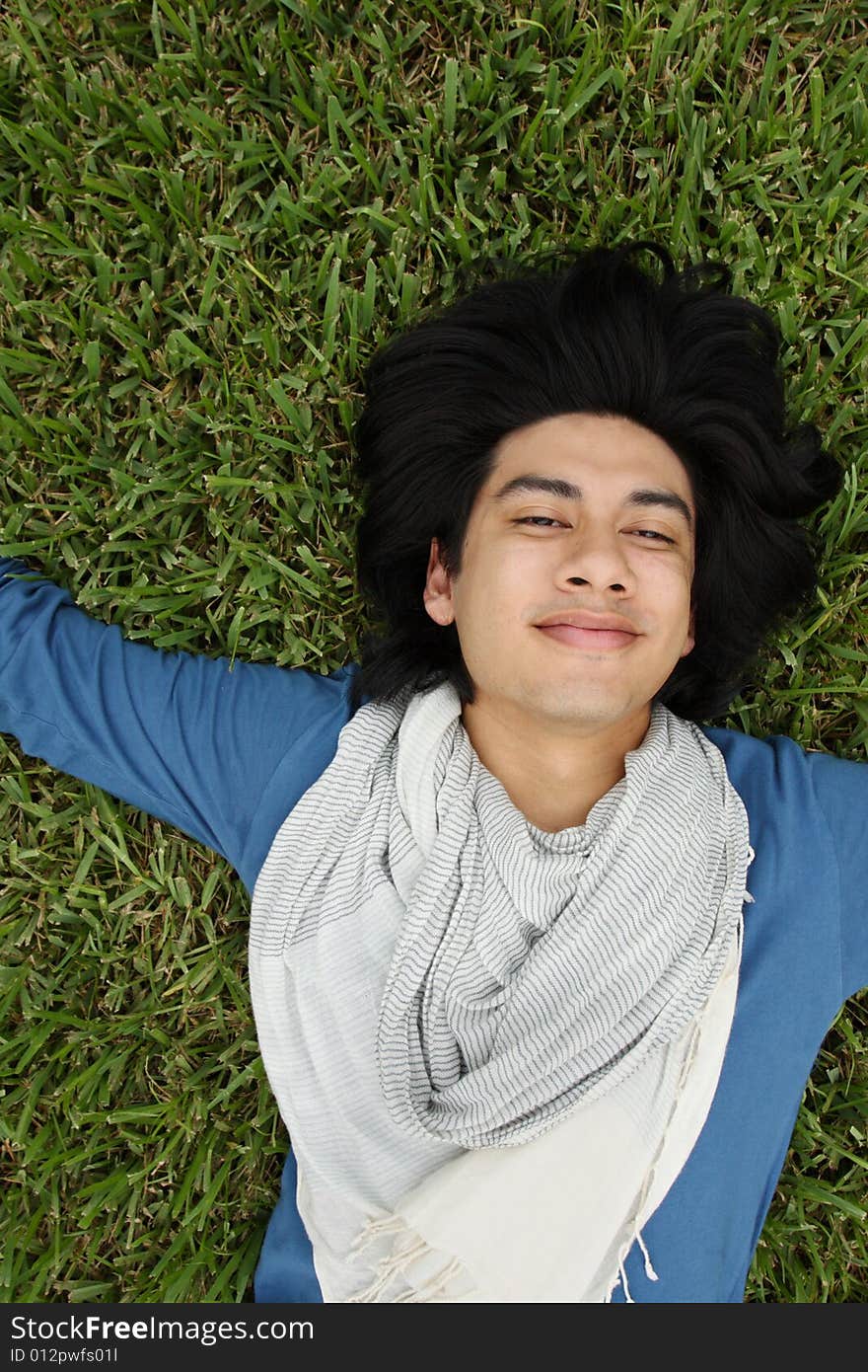 Man Laying On The Grass