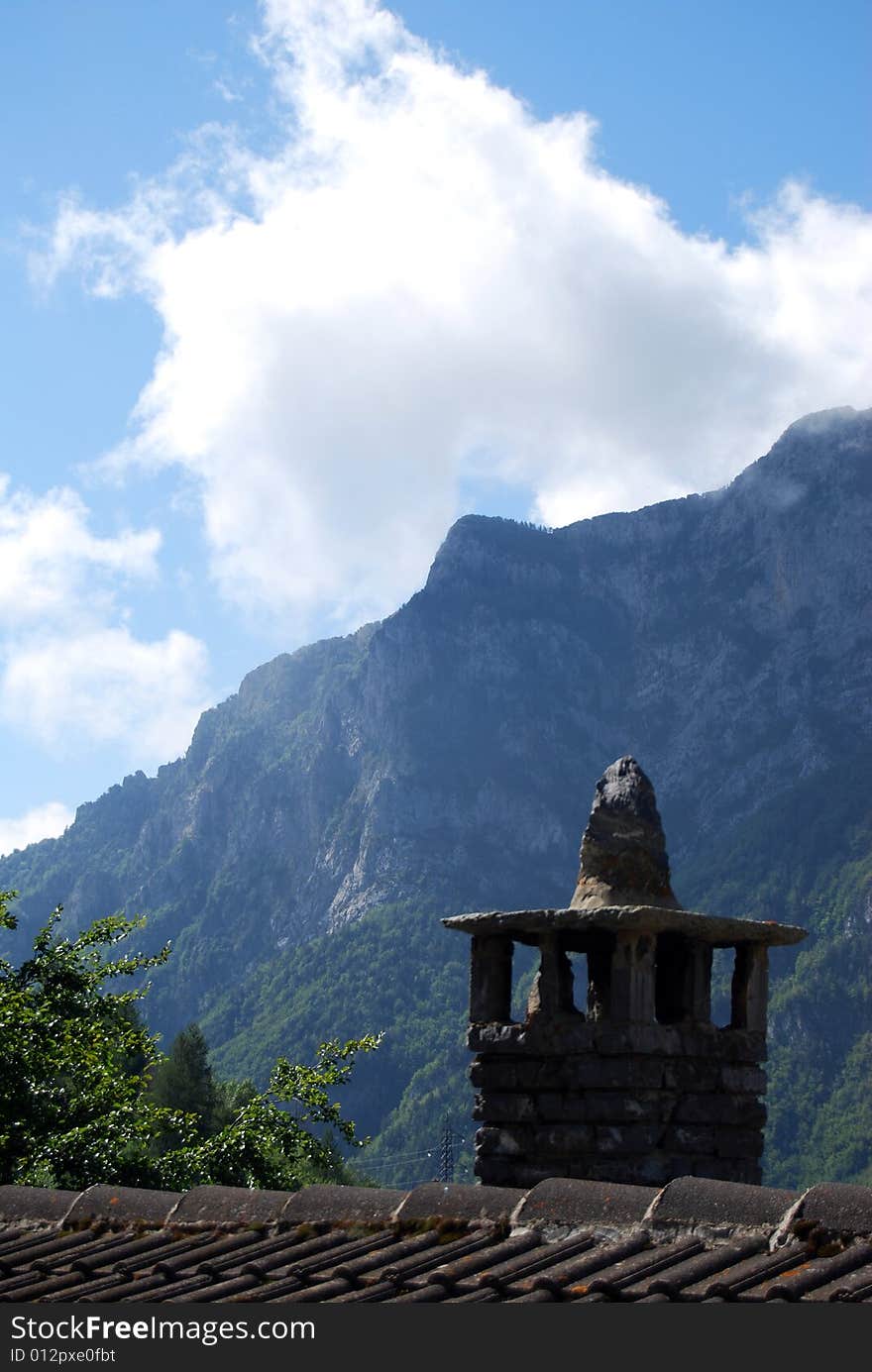 A chimney pot in a mountain village in Piedmont, Italy. A chimney pot in a mountain village in Piedmont, Italy.