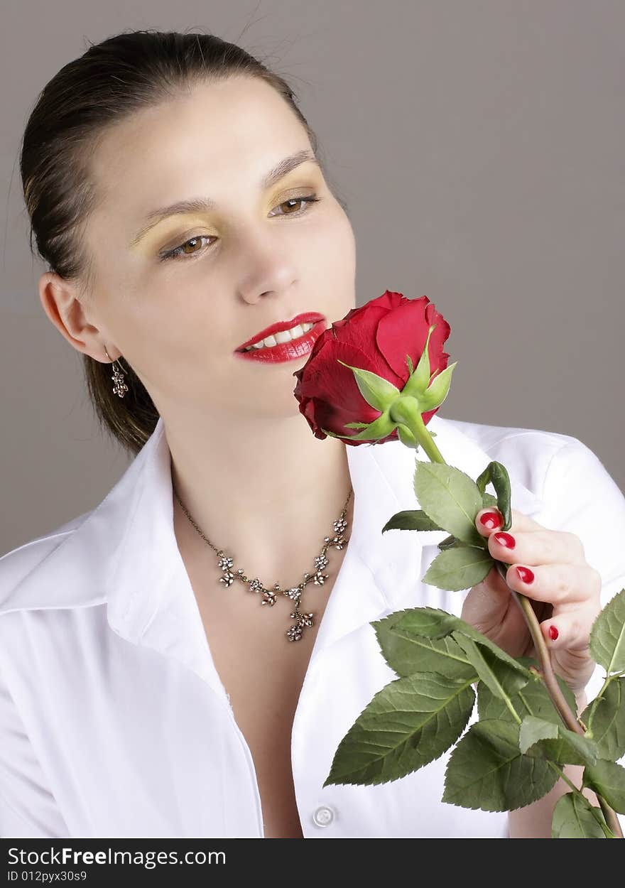 Beautiful girl with red rose