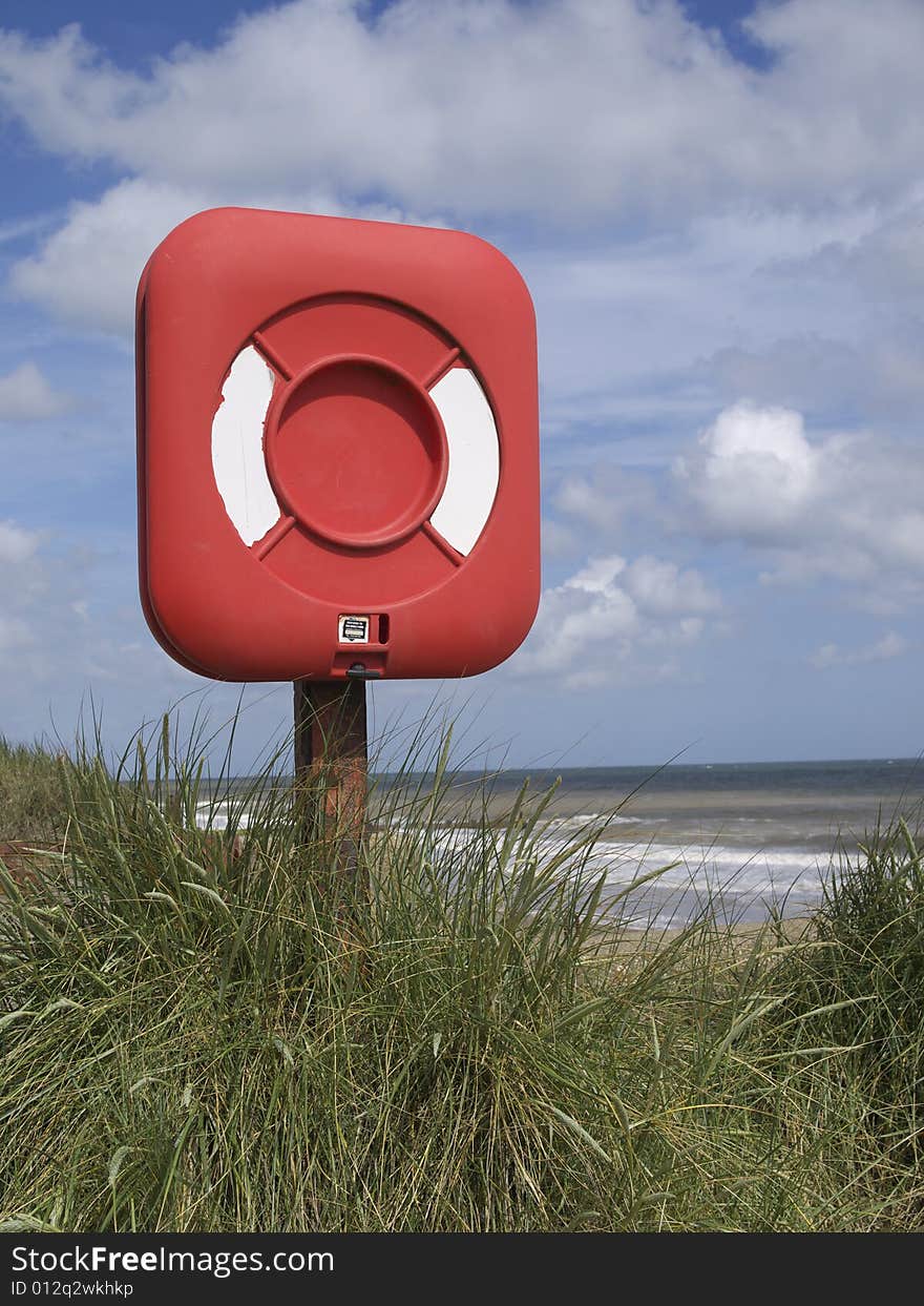 Life belt in a cover by the beach. Life belt in a cover by the beach.