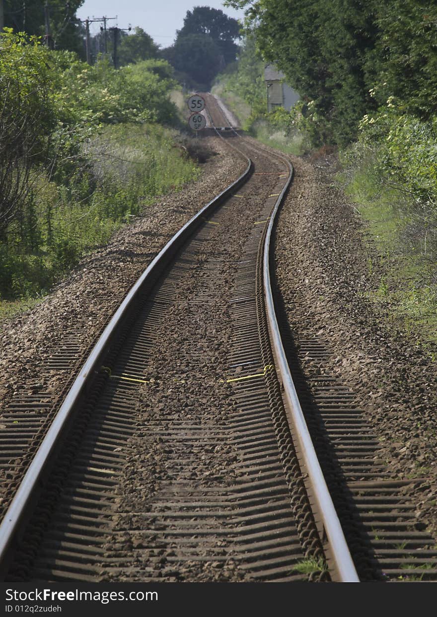 Track with a curve disappearing into the distance. Track with a curve disappearing into the distance.