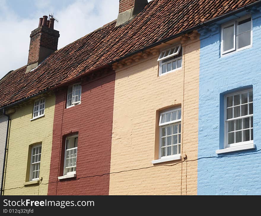 Multicolored houses in a street , stripy. Multicolored houses in a street , stripy.