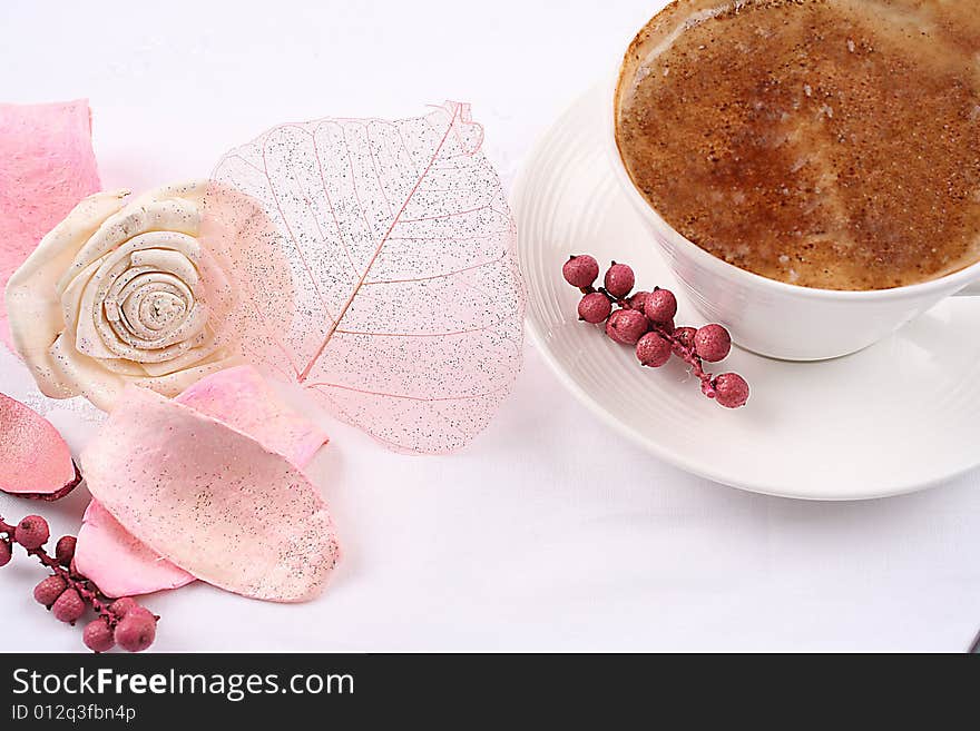 Cup of coffee and dry flowers