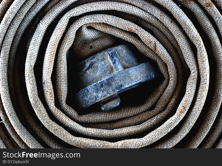 Rolled Old Fire-hose with connector