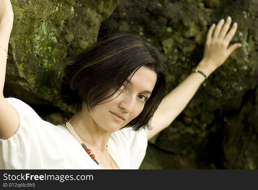 Portrait of pretty unhappy woman in the cave