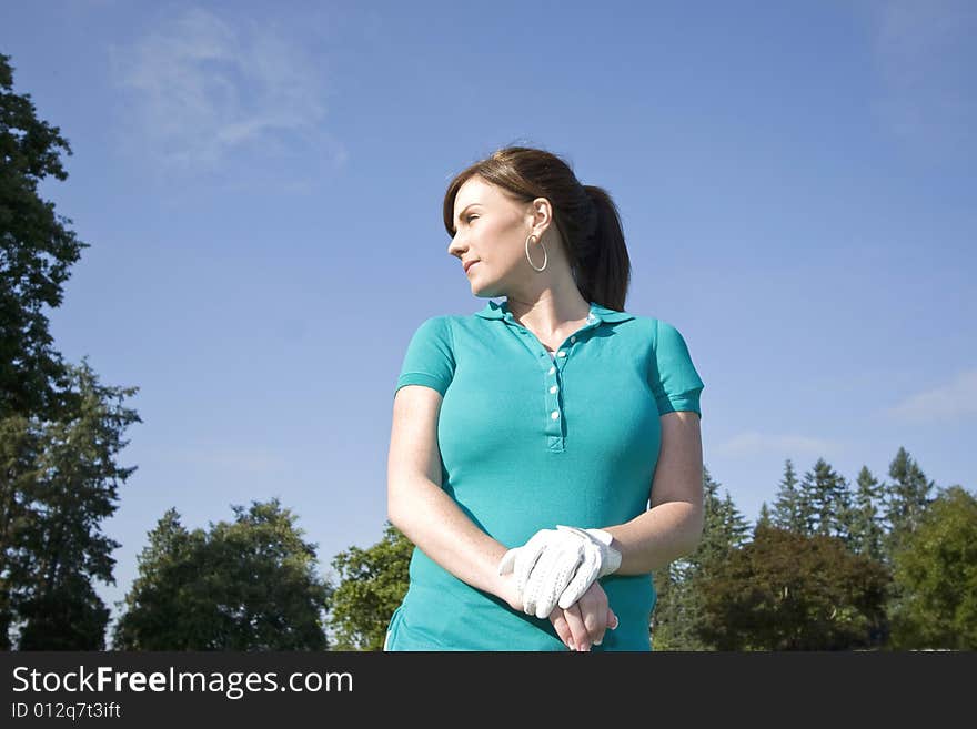 Woman Standing On Golf Course - Horizontal