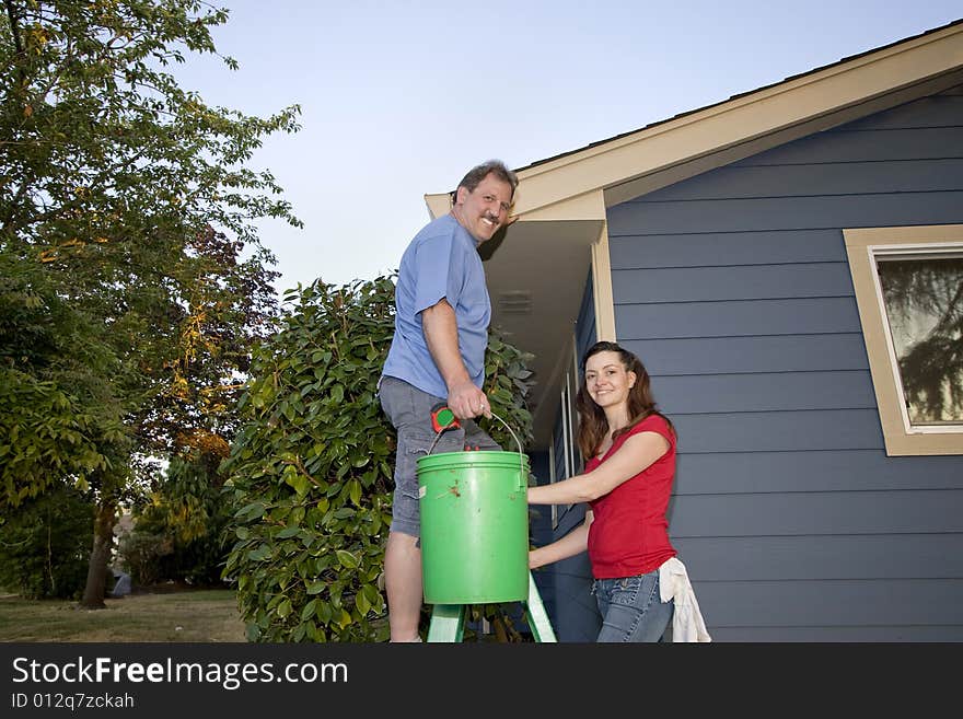 Couple with a Bucket and Ladder - Horizontal