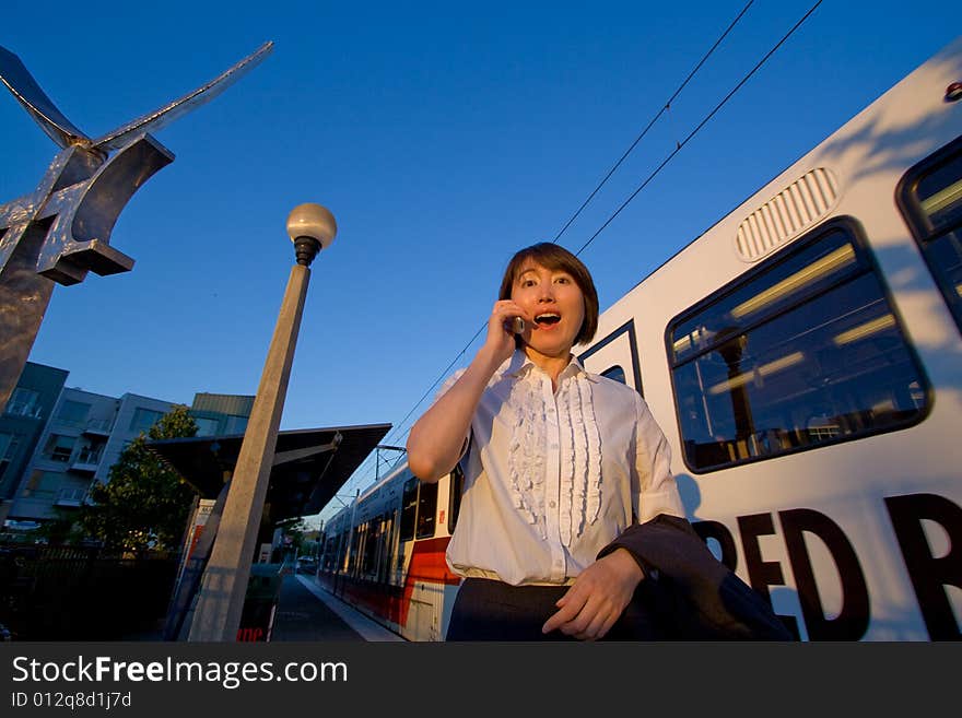 Woman on Cellphone Looking Surprised - Horizontal