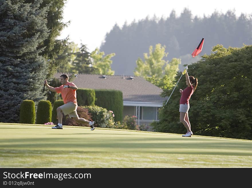 Couple Playing Golf - Horizontal