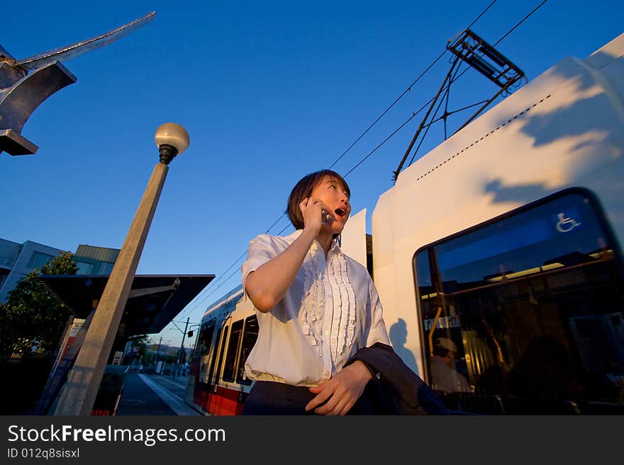 Woman on Cellphone Looking Surprised - Horizontal