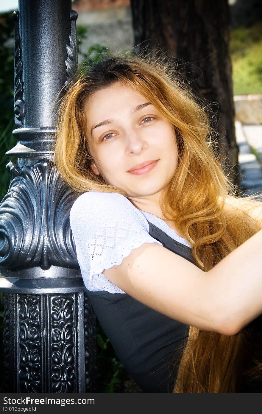 Serene smiling young woman with beautiful blond hair