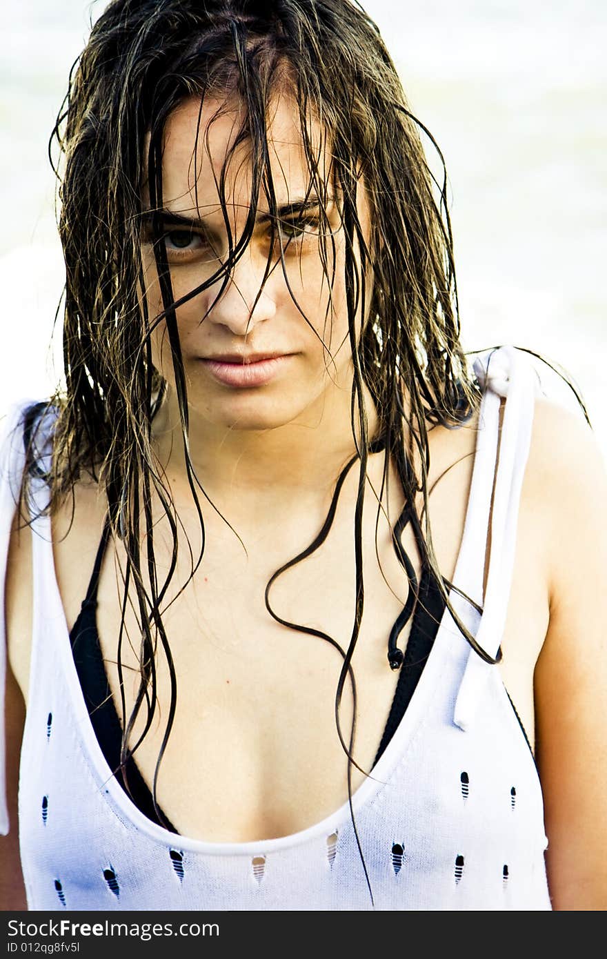 Wet hair woman staring sensually at camera.