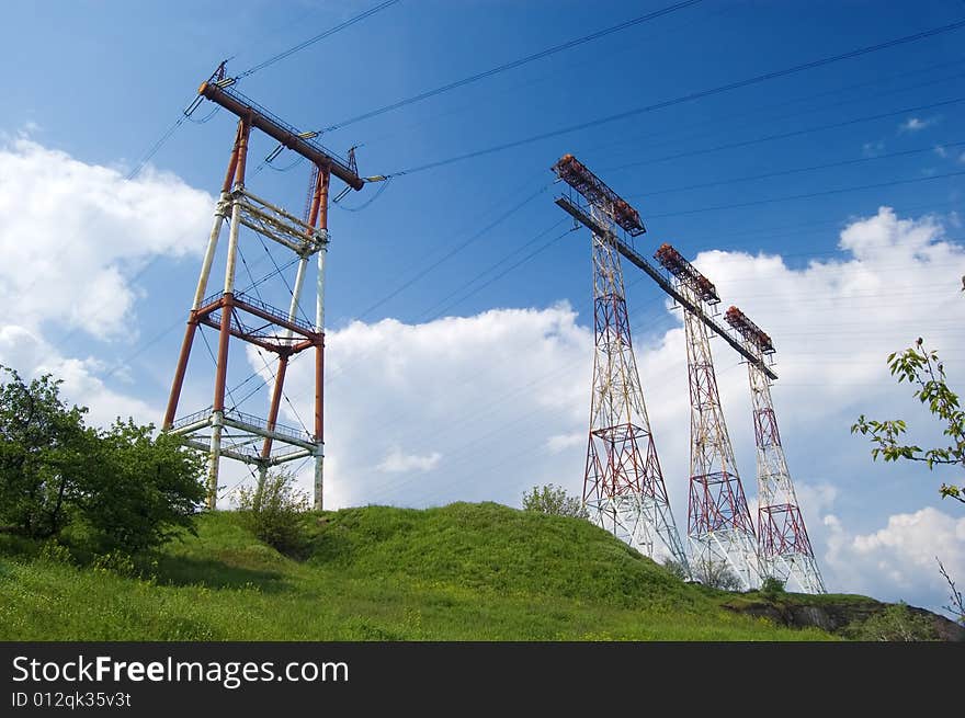 Powerline on green field