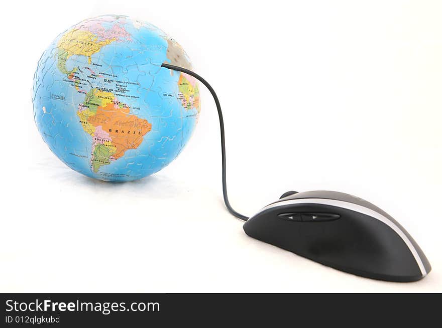 Isolated computer mouse and a globe shot over white background. Isolated computer mouse and a globe shot over white background