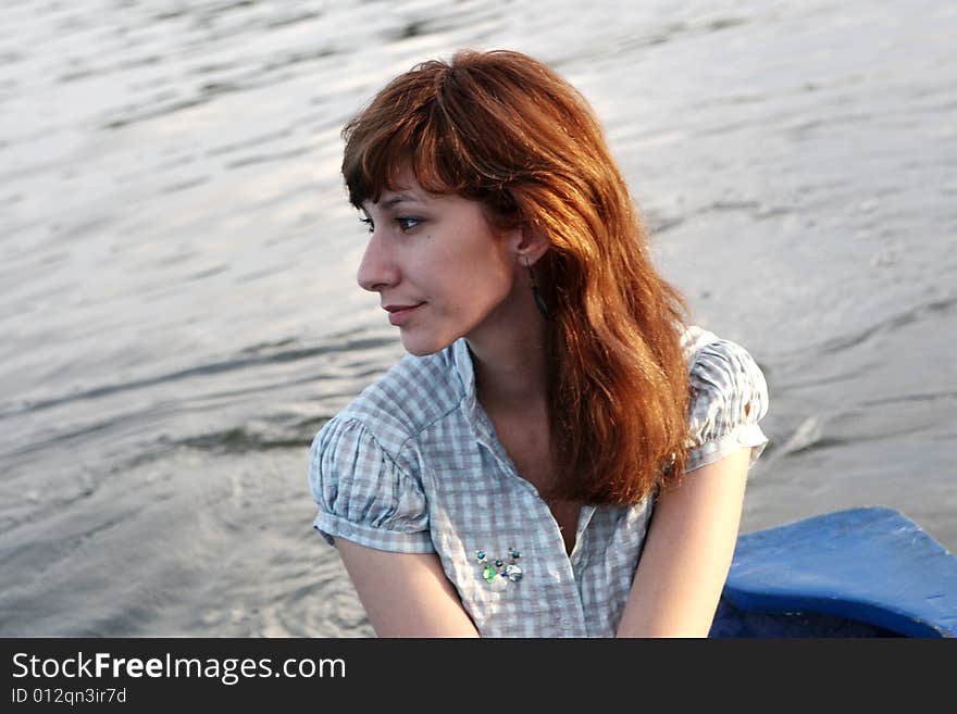 A young girl alone on the boat. A young girl alone on the boat