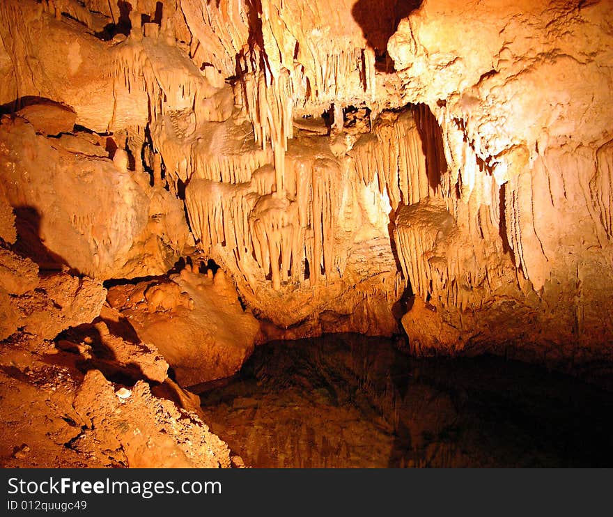 The underground water with stalactites inside Crystal & Fantasy caves in Bermuda. The underground water with stalactites inside Crystal & Fantasy caves in Bermuda.