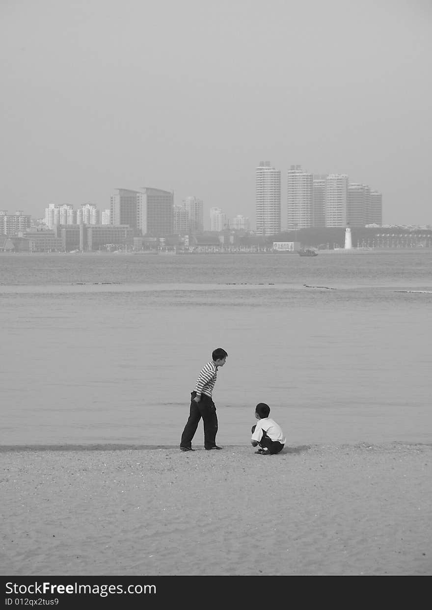 Too boys were playing in the beach