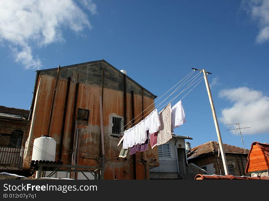 Clothes hanging on a clothesline outside a house