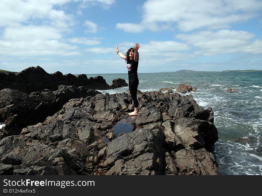 A beautiful woman doing yoga to show a healthy way to live a happy and relaxed lifestyle in a world full of stress. A beautiful woman doing yoga to show a healthy way to live a happy and relaxed lifestyle in a world full of stress