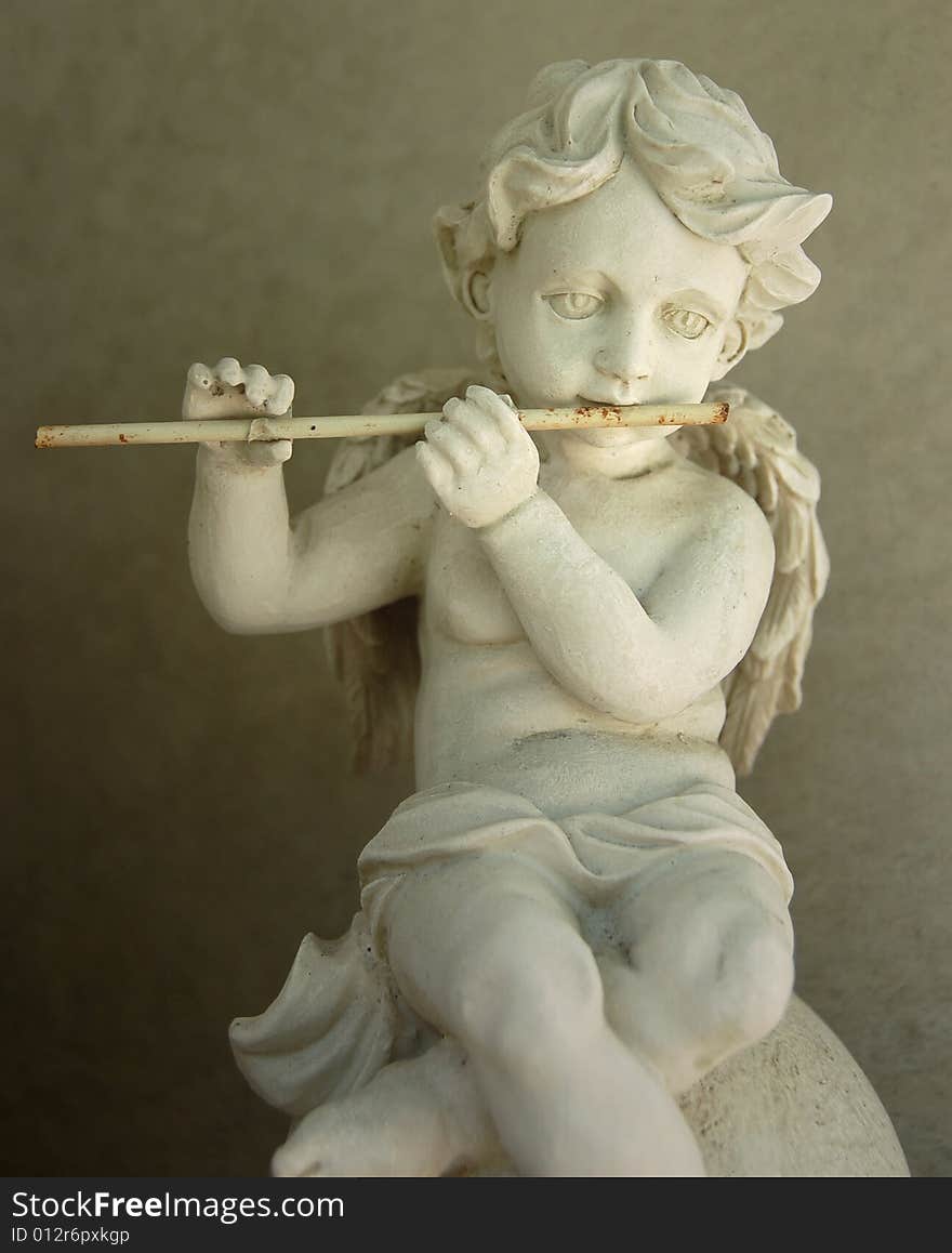 Old figurine - Flute playing angel