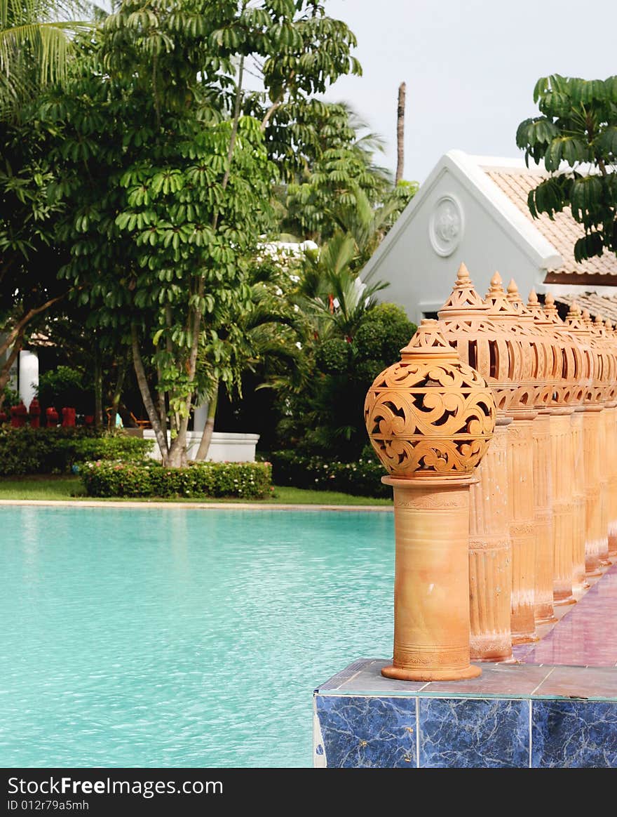 Ceramic decorations next to a swimming pool.