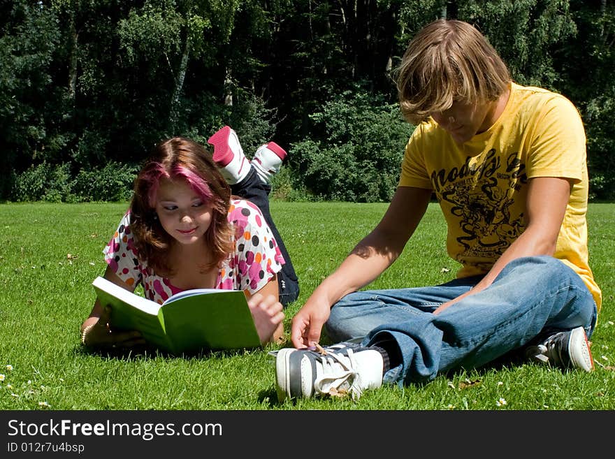 Students studying in a park in the summertime. Students studying in a park in the summertime