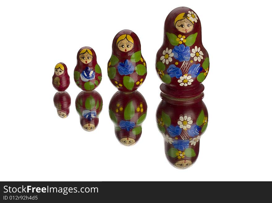 Matryoshka on a mirror with white background