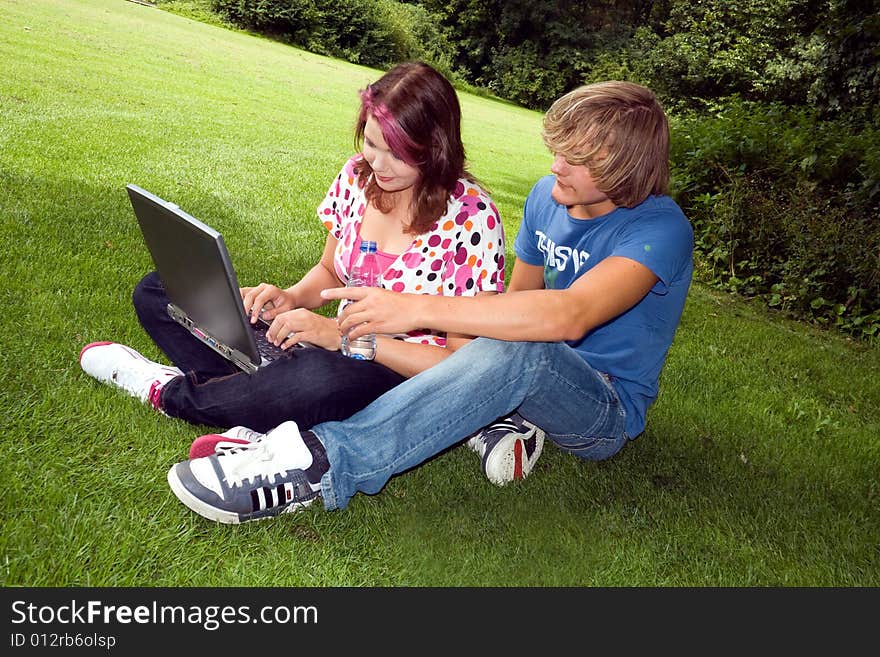 Students studying in a park in the summertime. Students studying in a park in the summertime