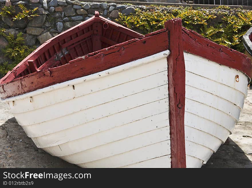 An old abandoned fishing boat, lying on dry dock in Hermanus harbor