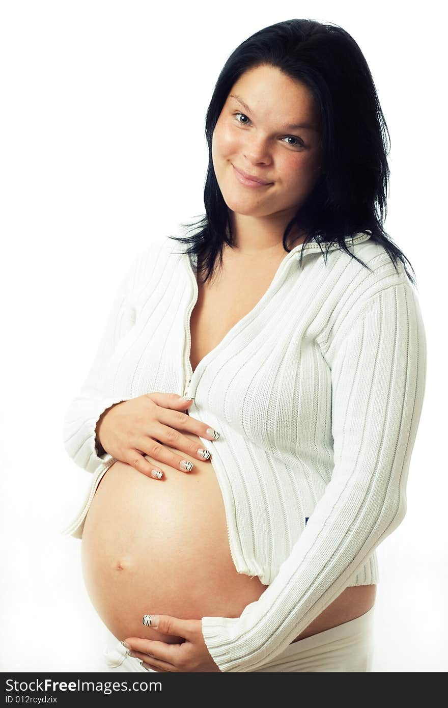 Young cute pregnant woman holding her abdomen. Young cute pregnant woman holding her abdomen.