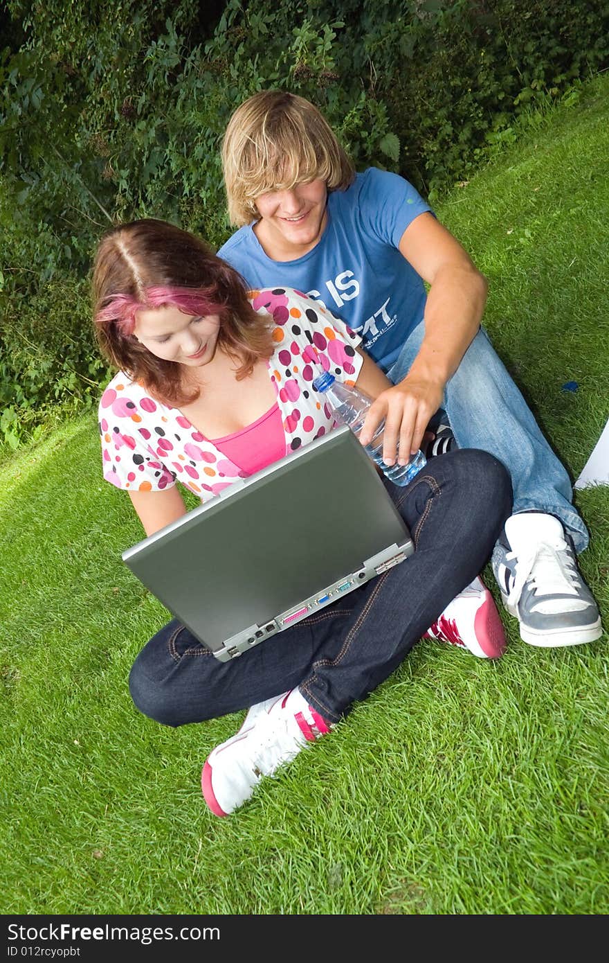 Students studying in a park in the summertime. Students studying in a park in the summertime