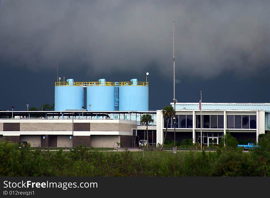 Pale blue holding tanks at a Florida water treatment plant, set against an ominously dark sky.

PHOTO ID: H2OTreatment00005. Pale blue holding tanks at a Florida water treatment plant, set against an ominously dark sky.

PHOTO ID: H2OTreatment00005