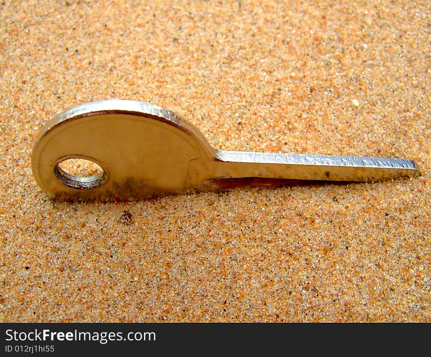 Photo of a key which will thrust in sand.