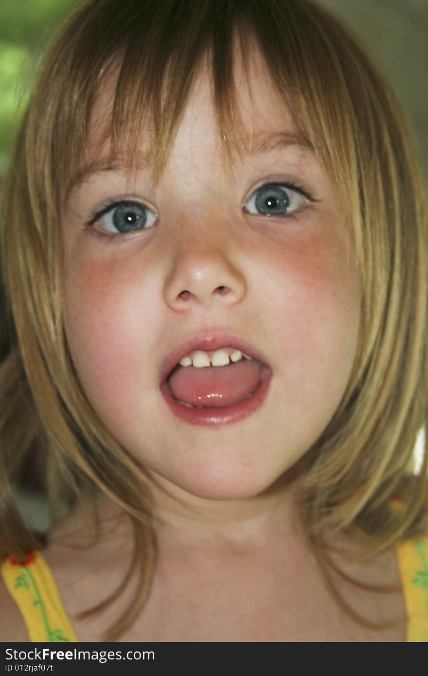 Head shot of little girl talking or singing. Head shot of little girl talking or singing