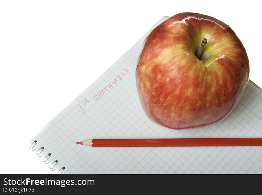 Red apple with notebook and red pencil. Red apple with notebook and red pencil