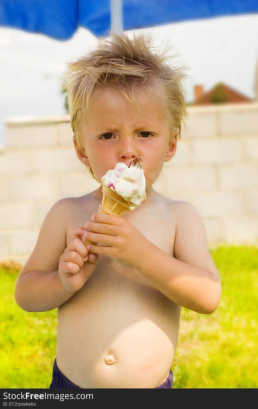 Little boy eating ice-cream